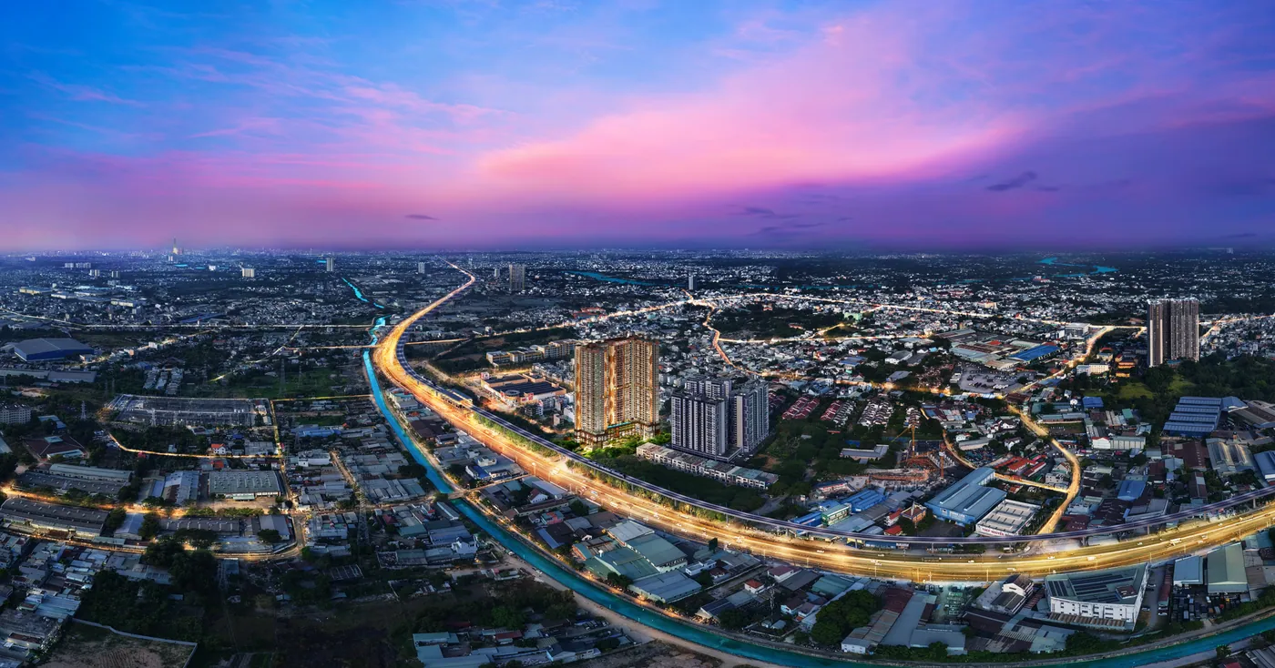 Phối cảnh trên cao dự án SkySOLIS lúc hoàng hôn, nhìn theo trục Quốc lộ 13 hướng về trung tâm TP.HCM
